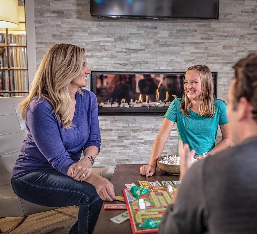 Family by Fireplace